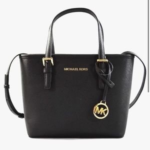 Michael Kors Jet Set Travel Extra-Small Top-Zip Tote Bag in black. NEVER USED
